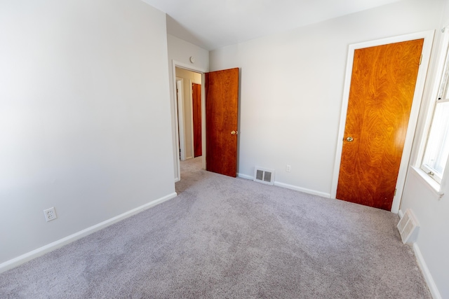 18953 Woodcrest St, Harper Woods, MI 48225 - carpeted spare room with visible vents and baseboards