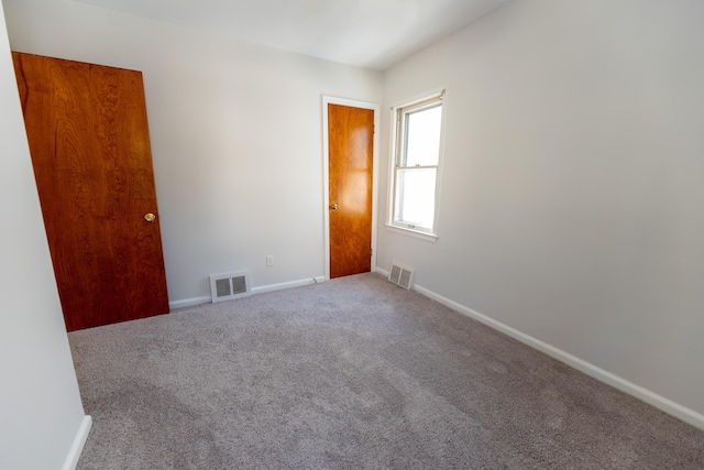 18953 Woodcrest St, Harper Woods, MI 48225 - carpeted spare room featuring visible vents and baseboards