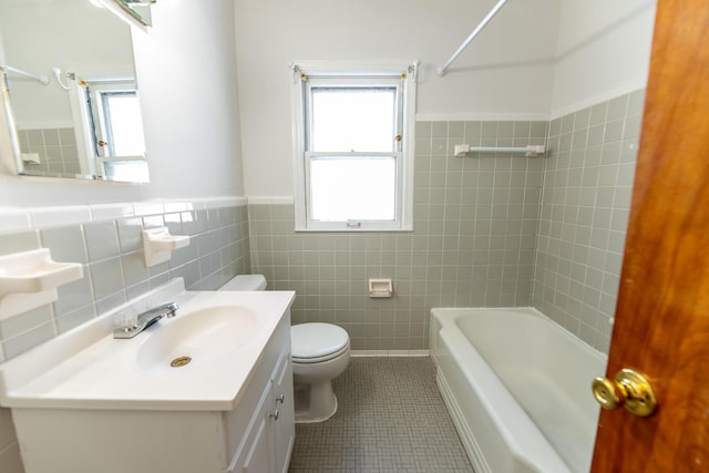 18953 Woodcrest St, Harper Woods, MI 48225 - bathroom featuring toilet, tile walls, vanity, wainscoting, and tile patterned floors