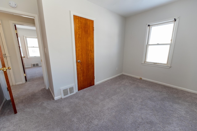 18953 Woodcrest St, Harper Woods, MI 48225 - carpeted empty room with baseboards and visible vents