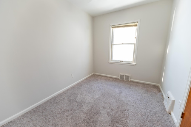 18953 Woodcrest St, Harper Woods, MI 48225 - spare room featuring light carpet, baseboards, and visible vents
