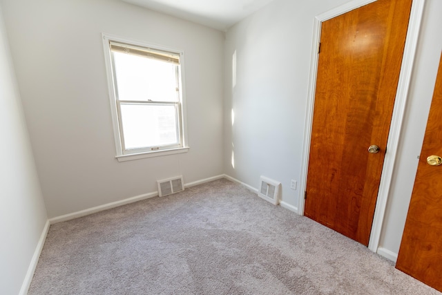 18953 Woodcrest St, Harper Woods, MI 48225 - empty room with visible vents, light carpet, and baseboards