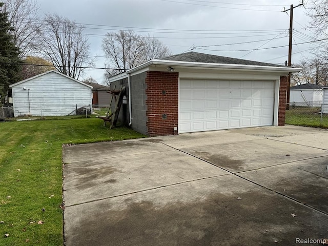 detached garage featuring fence