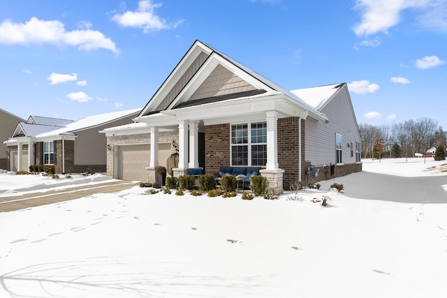 view of front of property featuring an attached garage and brick siding