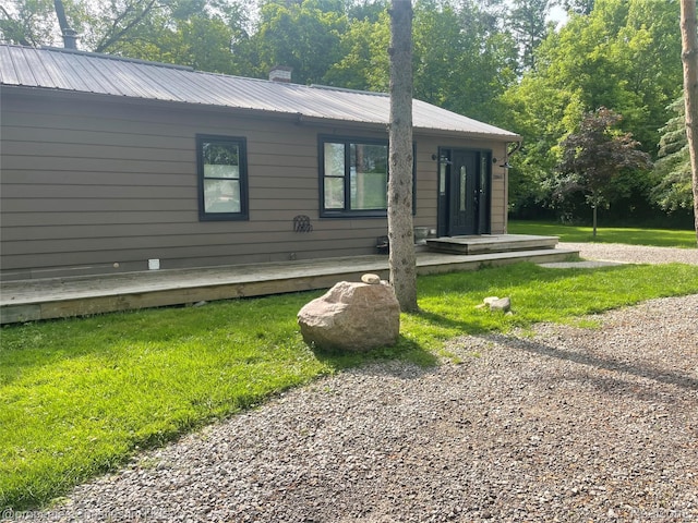 21865 Novi Rd, Northville, MI 48167 - view of front of property featuring a front lawn and a metal roof