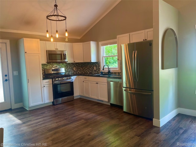 21865 Novi Rd, Northville, MI 48167 - kitchen with appliances with stainless steel finishes, dark countertops, white cabinets, crown molding, and high vaulted ceiling