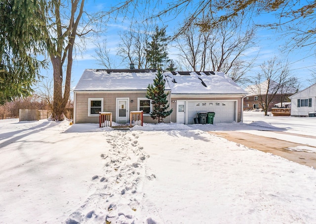 view of front of house featuring driveway and an attached garage