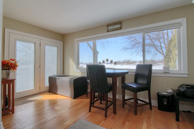 dining space with light wood finished floors