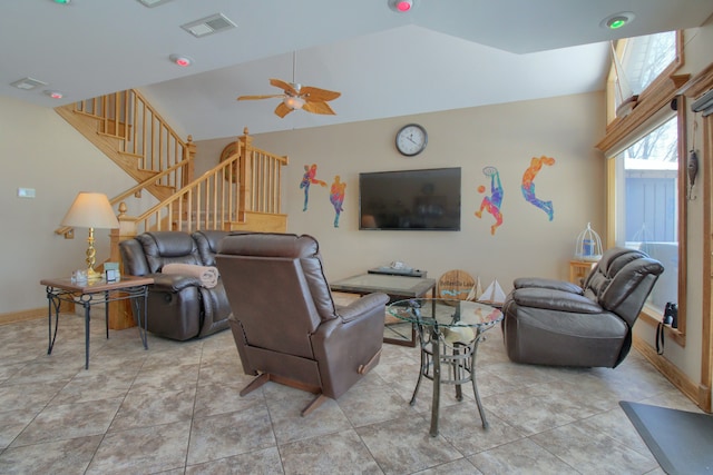 living room with light tile patterned floors, lofted ceiling, visible vents, stairway, and ceiling fan