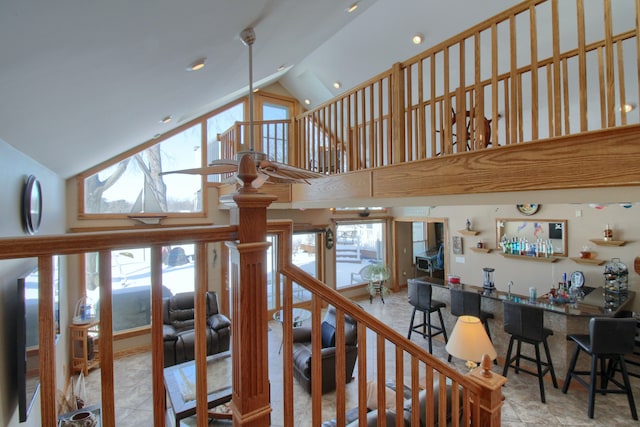 stairway with high vaulted ceiling