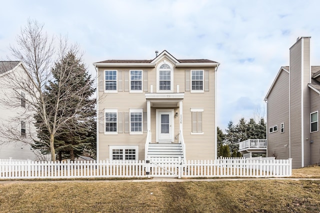 view of front of house featuring a front yard and fence private yard