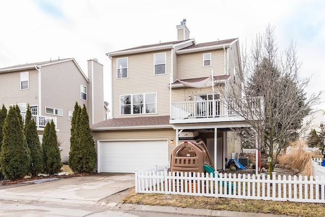 view of front of property with a playground, a garage, fence, concrete driveway, and a chimney