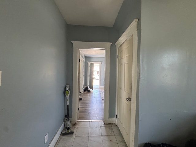hallway featuring baseboards