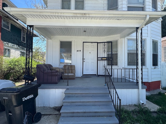 property entrance featuring covered porch