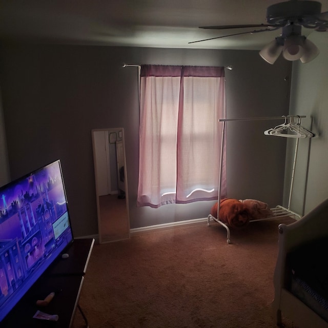 bedroom with carpet, baseboards, and a ceiling fan