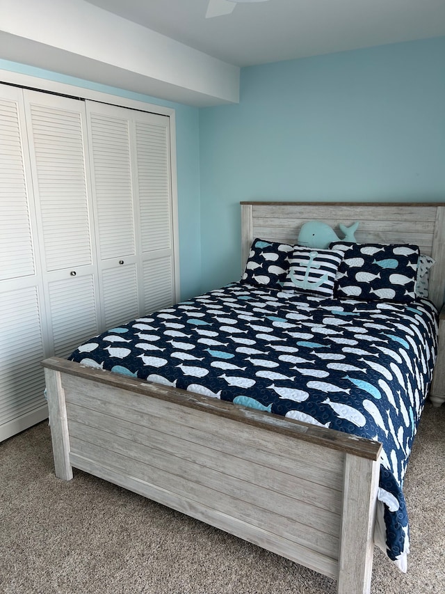 bedroom featuring carpet and a closet