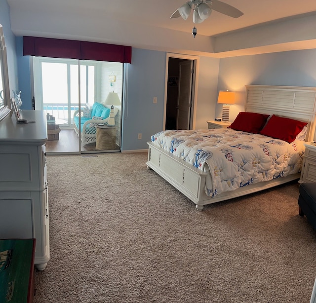 bedroom featuring carpet, a closet, a ceiling fan, access to outside, and baseboards