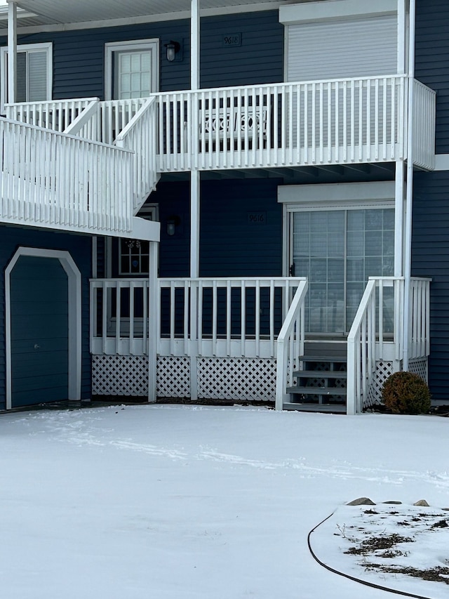 snow covered house with a balcony