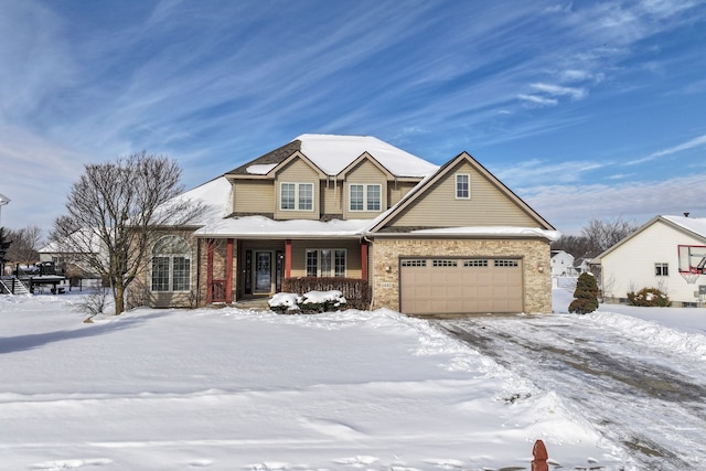 traditional-style home featuring a garage, stone siding, and a porch