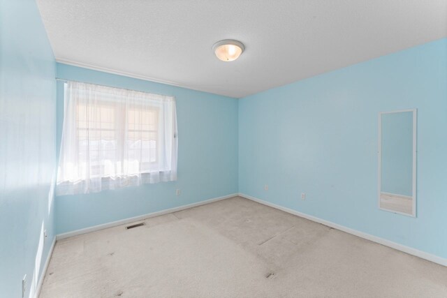 6440 Wailea Dr, Grand Blanc, MI 48439 - carpeted spare room with visible vents and baseboards