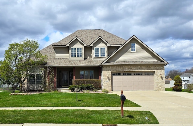 6440 Wailea Dr, Grand Blanc, MI 48439 - craftsman-style home featuring driveway, roof with shingles, a front yard, and a garage