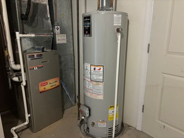 utilities with gas water heater and heating unit