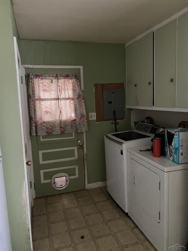 clothes washing area with light floors, independent washer and dryer, cabinet space, and electric panel