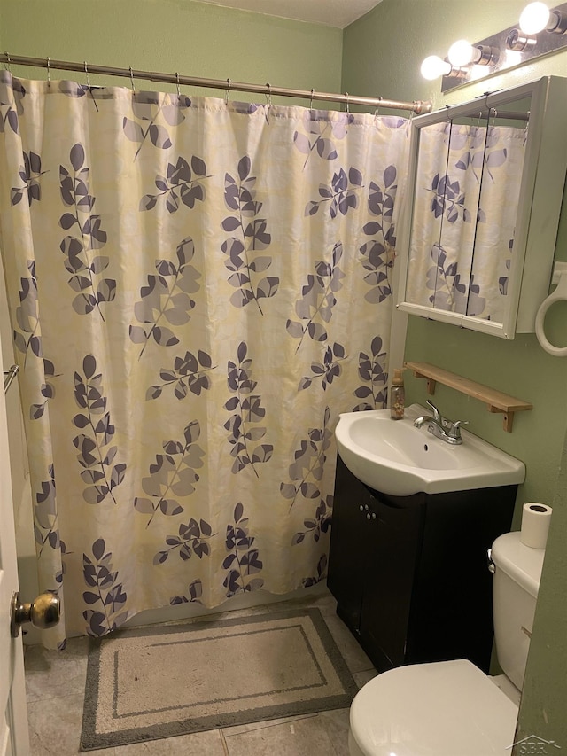 full bathroom with toilet, a shower with curtain, tile patterned floors, and vanity