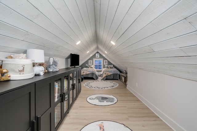 interior space with baseboards, lofted ceiling, wooden ceiling, light wood-style floors, and recessed lighting