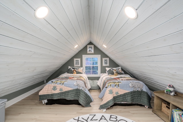 bedroom with light wood-style floors, lofted ceiling, and wooden ceiling