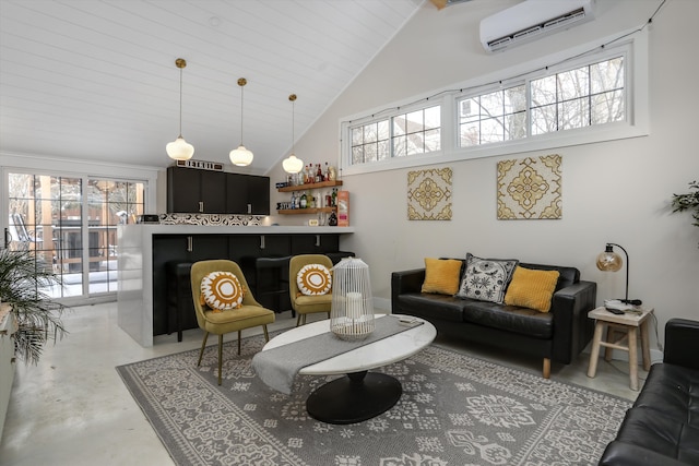 living room with a wall unit AC, high vaulted ceiling, indoor bar, and concrete flooring