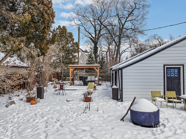 snow covered patio with fence