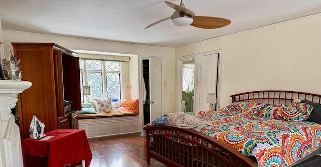 bedroom with dark wood-style flooring and ceiling fan