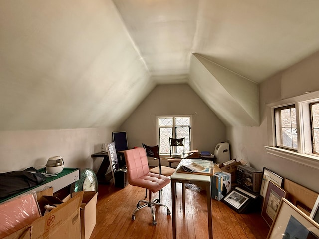 interior space with lofted ceiling and wood finished floors