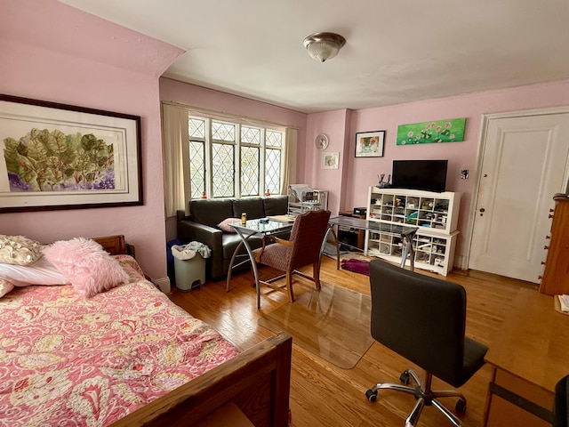 bedroom with wood finished floors