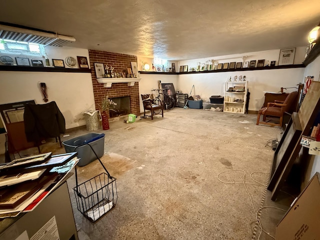 basement featuring a fireplace and a textured ceiling