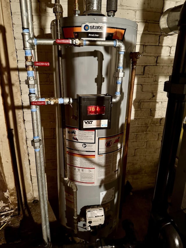 utility room featuring water heater