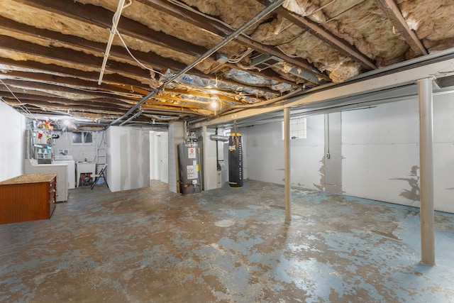 unfinished basement with a sink, washer and dryer, and gas water heater