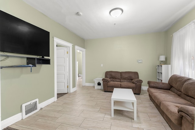 living room with visible vents and baseboards