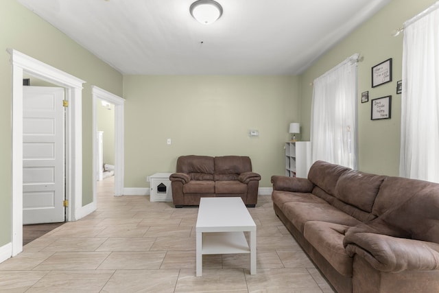 living room featuring baseboards