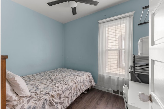 bedroom with dark wood-style flooring and ceiling fan