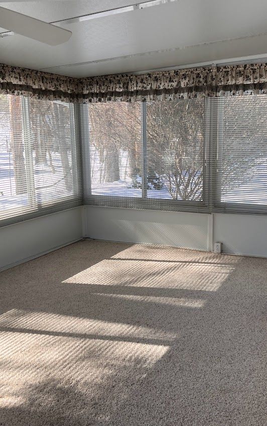 unfurnished sunroom with a healthy amount of sunlight