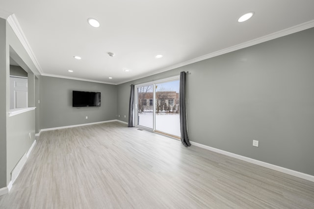 unfurnished living room with light wood finished floors, ornamental molding, recessed lighting, and baseboards