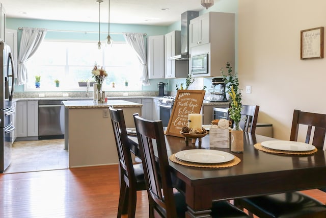 dining space featuring wood finished floors