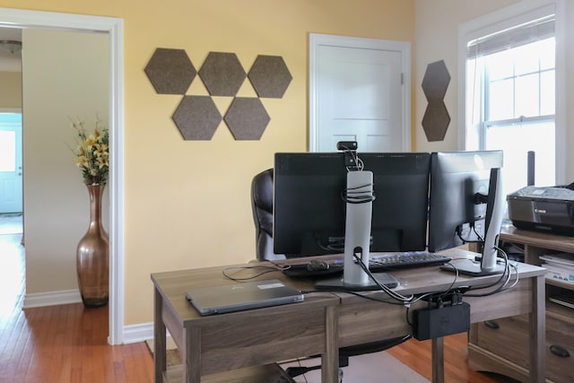 home office with wood finished floors and baseboards