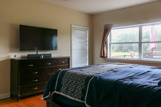 bedroom with light wood-style floors