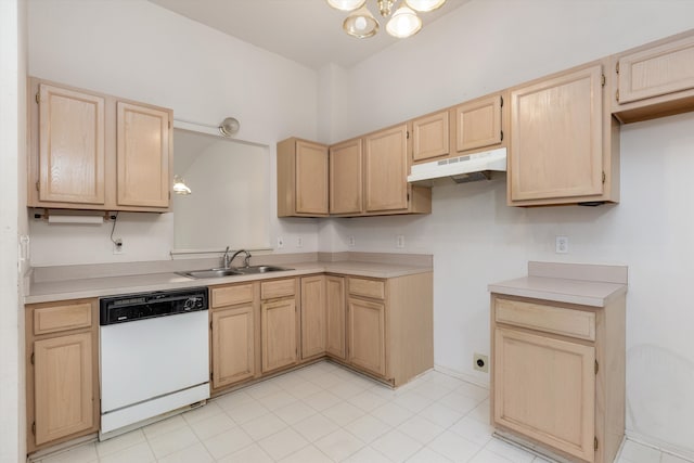 kitchen with light brown cabinetry, white dishwasher, a sink, and under cabinet range hood