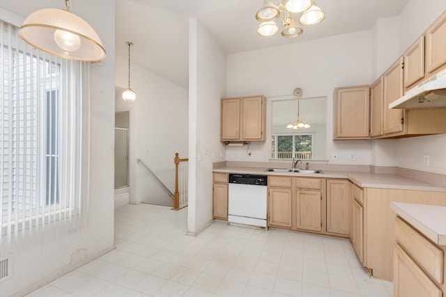 kitchen featuring a notable chandelier, white dishwasher, light countertops, light brown cabinetry, and a sink