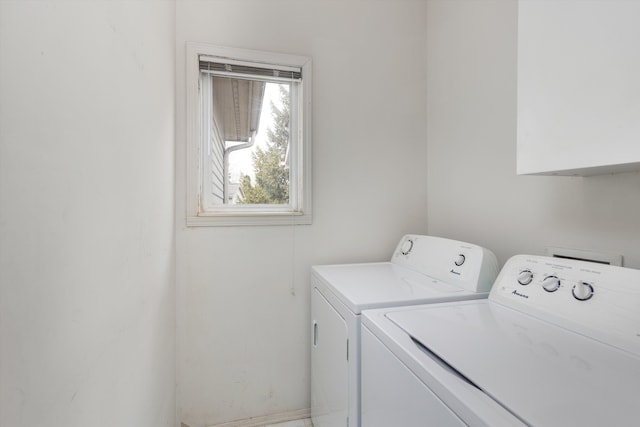 laundry area with cabinet space and washing machine and clothes dryer