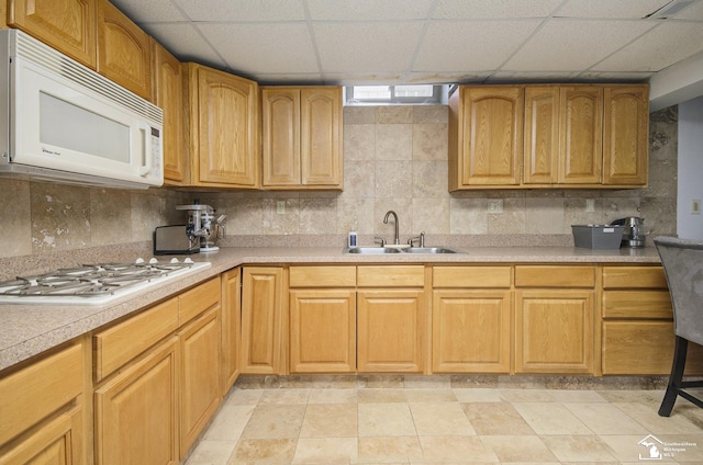 7740 Ternes St, Dearborn, MI 48126 - kitchen with white appliances, decorative backsplash, light countertops, and a sink